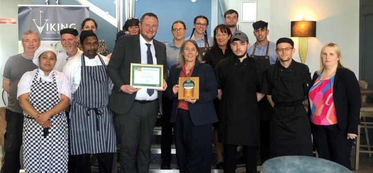 Viking Hotel Team with Employer Excellence plaque