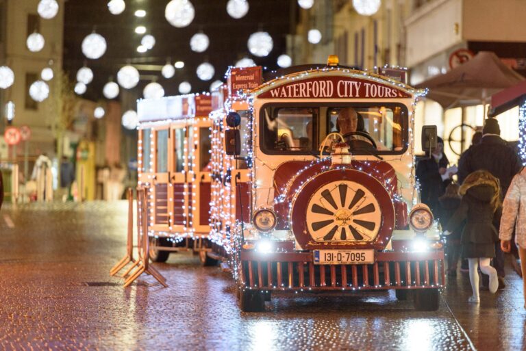 Winterval train driving through the town with Christmas lights on