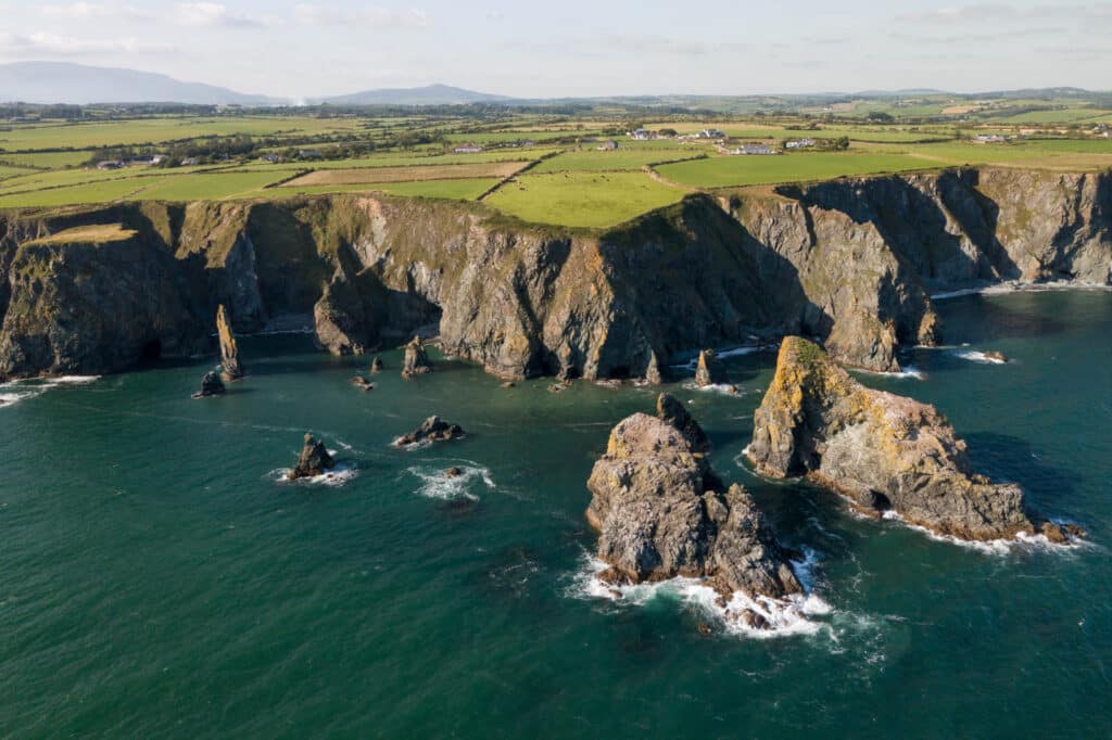 Aerial shot of the coast of Waterford with the sea