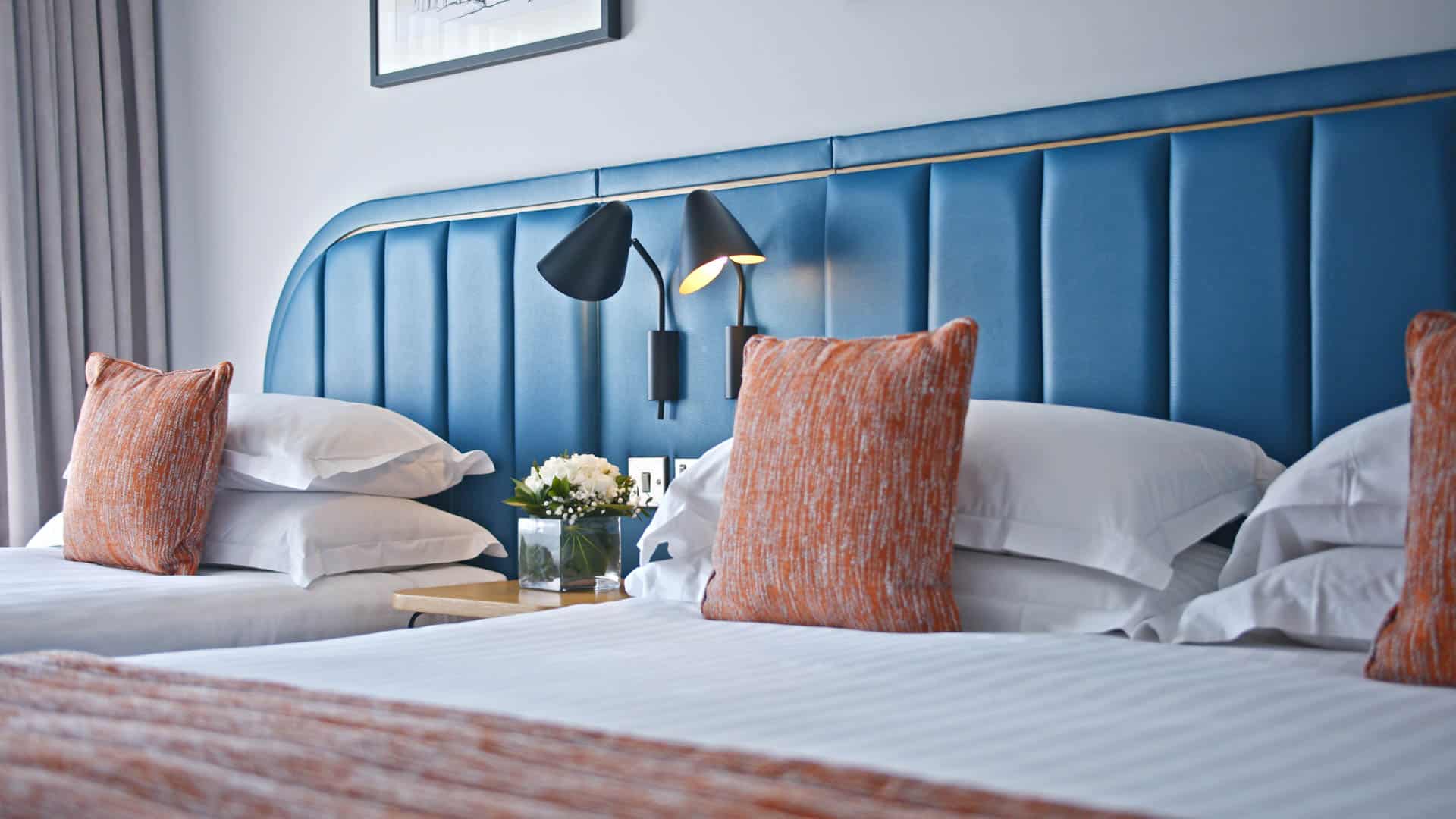 Low shot of king and single bed in superior room