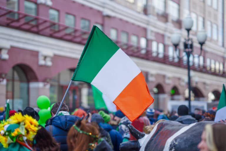 St.Patricks Day Parade - Irish flag flown above the crowd